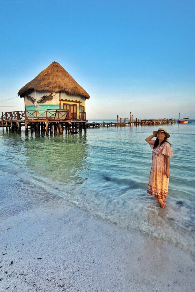 Sara in Holbox pier at sunrise